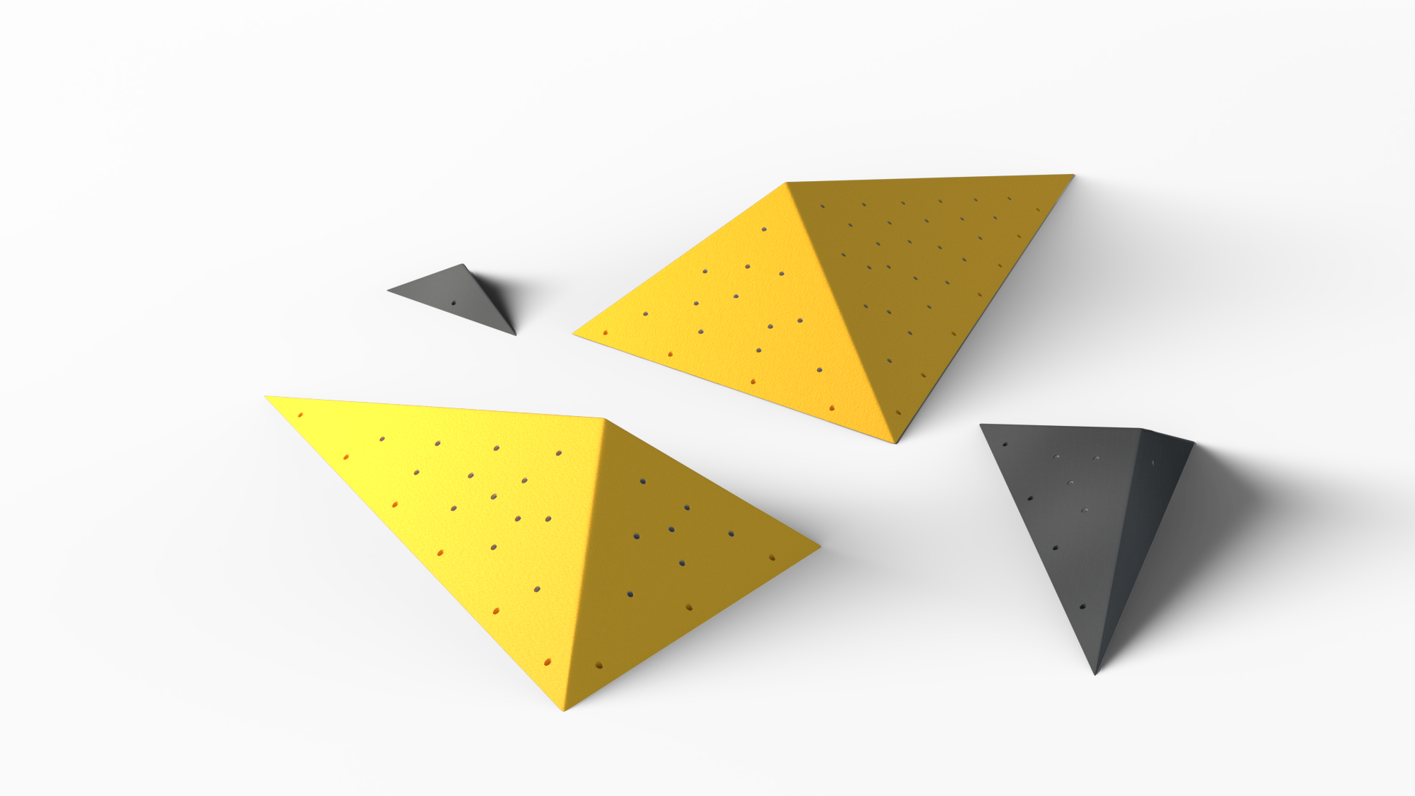 Vier verschieden große, dreieckige Volumen der Cornets Serie von Banana Volumes in schwarz und gelb.